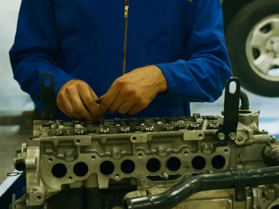 A cylinder head on the bench being worked on.