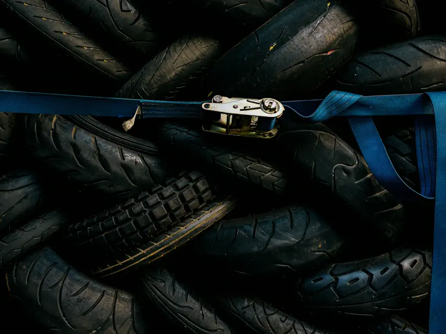 A stack of tyres in a workshop.